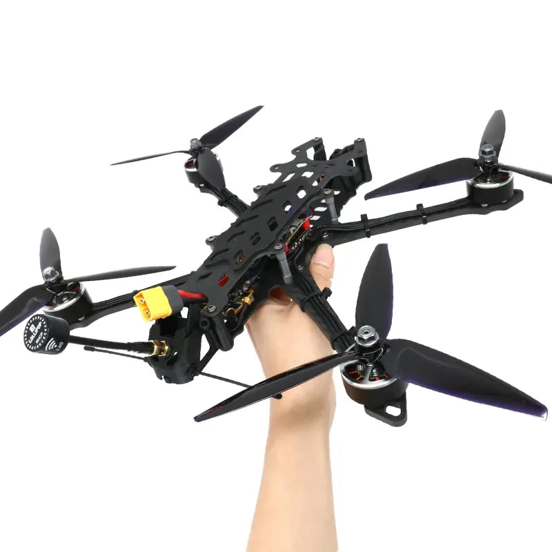 Black quadcopter drone with four propellers and carbon-fiber style frame