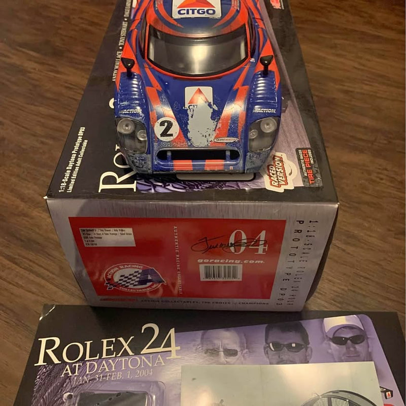 Diecast race car model in retail box with colorful orange-blue car graphics