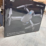 Foldable micro drone retail box with quadcopter and propeller arms