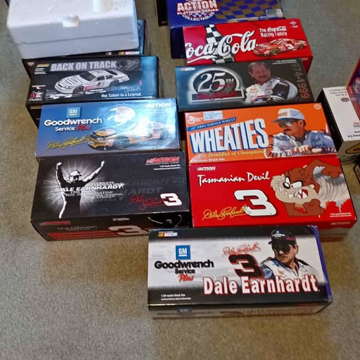 NASCAR diecast car boxes featuring Dale Earnhardt, Goodwrench, Coca-Cola, and WHEATIES