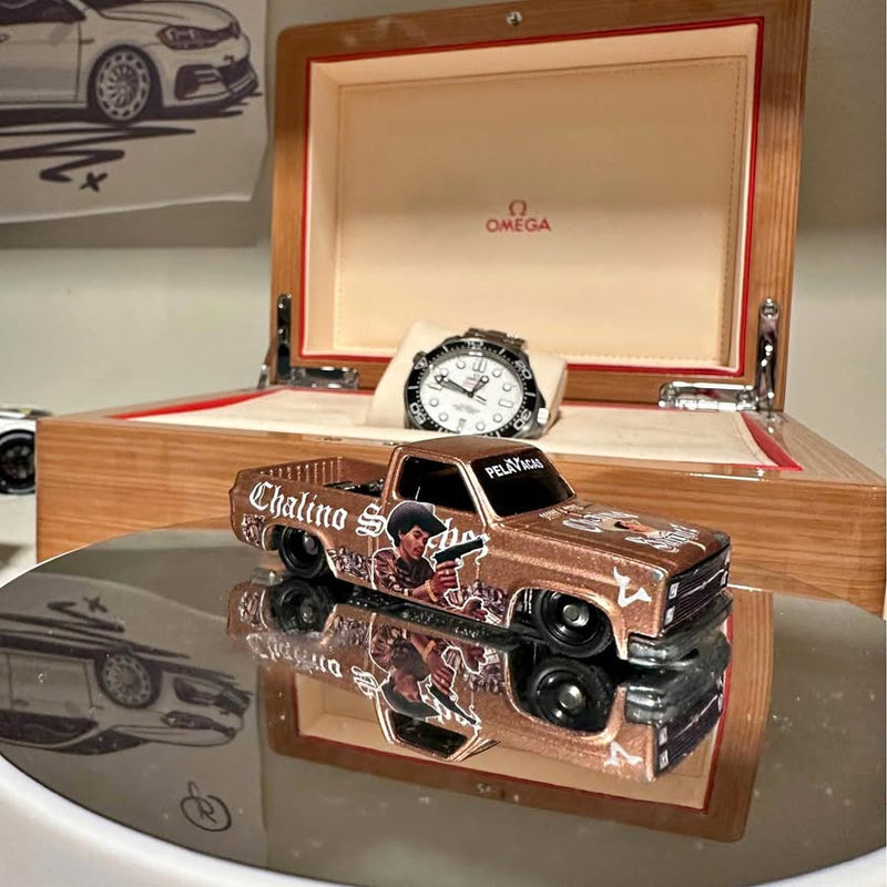 1983 Chevy Squarebody diecast model truck in brown, displayed in wooden case