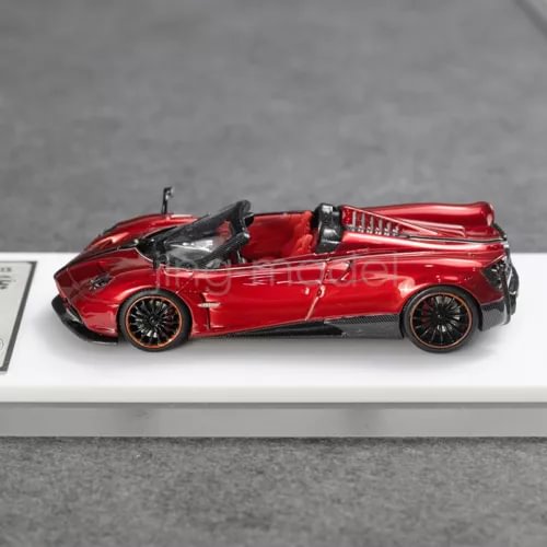 Flame red convertible sports car diecast resin model, side view, black wheels