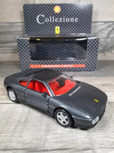 1:36 diecast model car, dark gray body with red interior and yellow side emblem