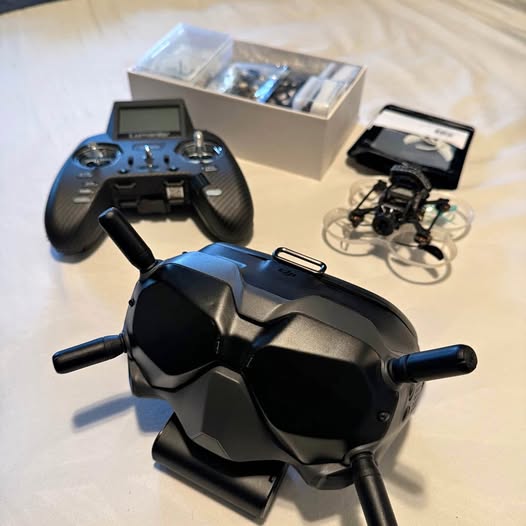 FPV drone with handheld controller and head-mounted display unit