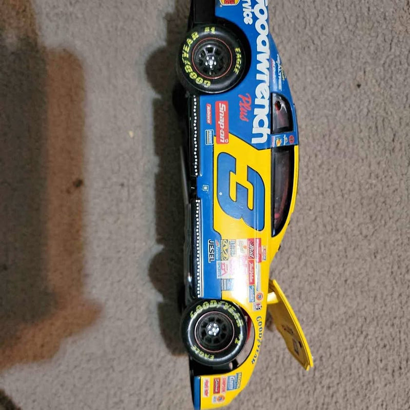 1/18 die-cast race car model in blue and yellow, black wheels, yellow tow strap