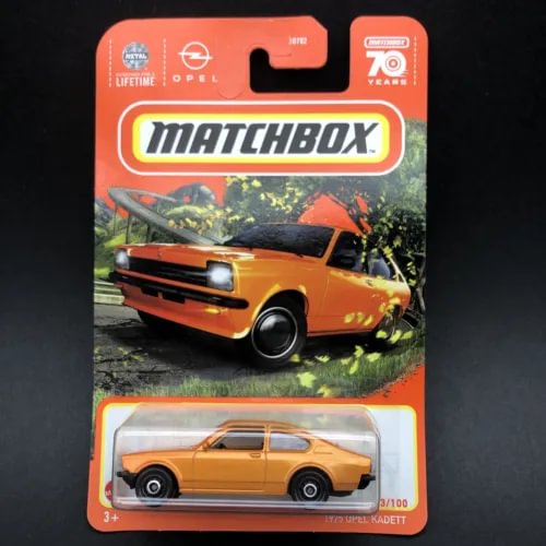 Orange Matchbox diecast car model in blister pack, 70 years Opel Kadett style