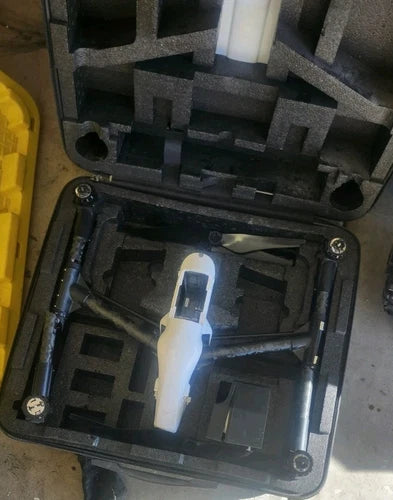 DJI Inspire 1 drone in hard case with foam cutouts and front camera visible