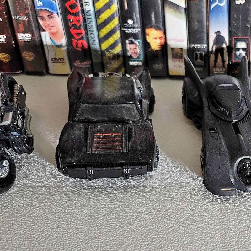 Black Batmobile diecast car with front grille and hood details