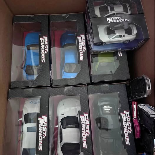 Fast and Furious diecast car display in boxes, mixed colors