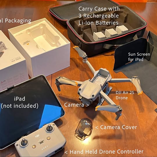 DJI Air2S drone with hand controller, camera cover, and carrying case
