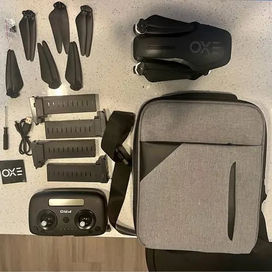 Drone parts kit with controller and gray carrying bag