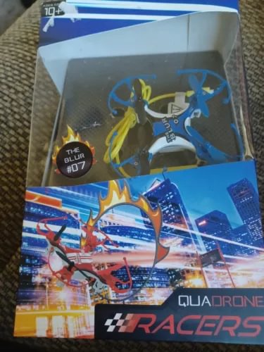 Blue racing drone in retail box, with quadcopter illustration and brand graphics