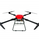 Agricultural sprayer drone with red top and four black propeller arms