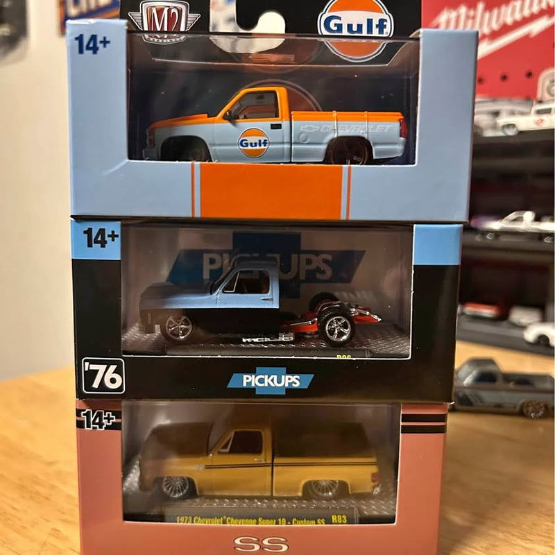 M2 diecast pickup truck in retail box, orange and white with Gulf branding