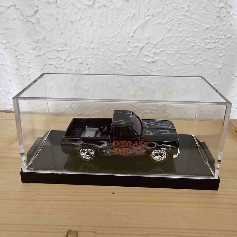 Black diecast 1983 Silverado model truck in clear display case