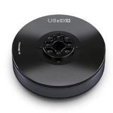 Black electric drone motor with circular housing and mounting hub