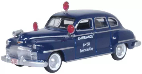 Blue diecast sedan model with ambulance-style markings, front three-quarter view