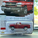 Red Chevrolet die-cast pickup truck in clear blister packaging