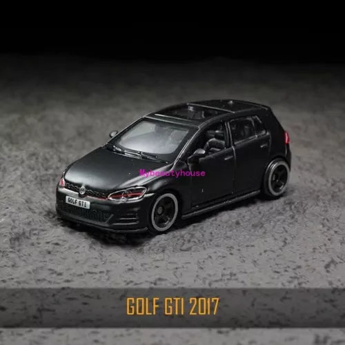 Black 1:64 diecast metal hatchback car toy, front 3/4 view