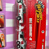 Red and white die-cast race car in blister packaging