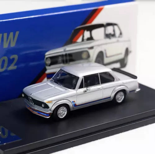 1/64 scale silver diecast classic car model with black grille and wheels