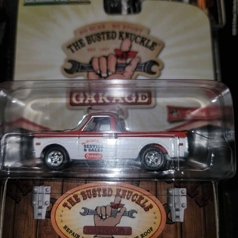 Light gray mini diecast pickup truck in clear blister with garage logo