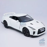 White 1:36 Nissian GTR R35 alloy diecast model car with black wheels, front view