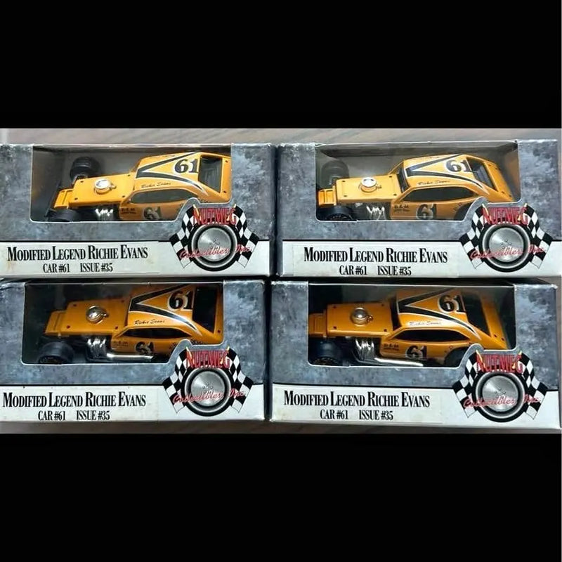 1/64 diecast race car model, yellow with checkered decals in blister packaging