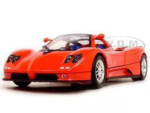 1/18 diecast sports car model, red with black front splitter and wheels.