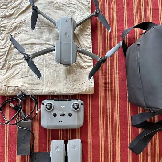 Gray foldable quadcopter drone with four propellers