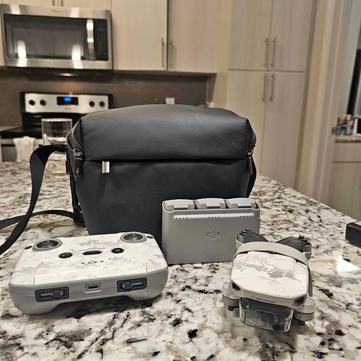Dji Mini 2 drone kit with controller, drone, and carry case