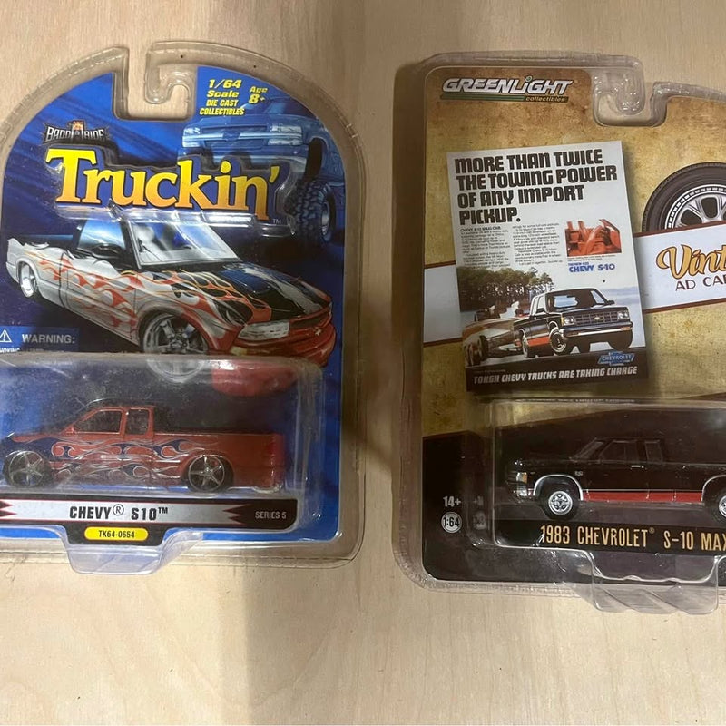 Red Chevrolet S-10 diecast truck in blister packaging, GreenLight truck box