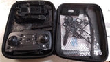 Folding drone with protective case, showing controller and drone inside zippered compartment
