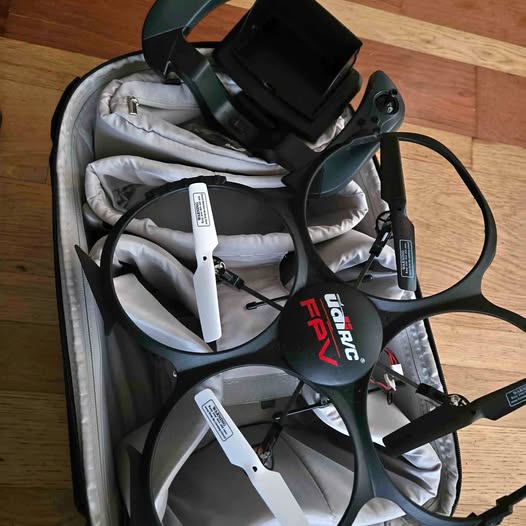 Drone with carrying backpack set, featuring gray lining and dark straps