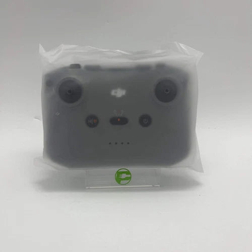 DJI remote controller with joysticks and front buttons, dark gray