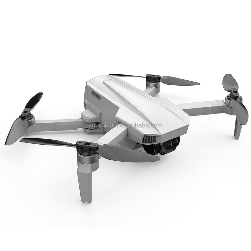 Foldable quadcopter drone with 4 propellers and onboard camera, light gray