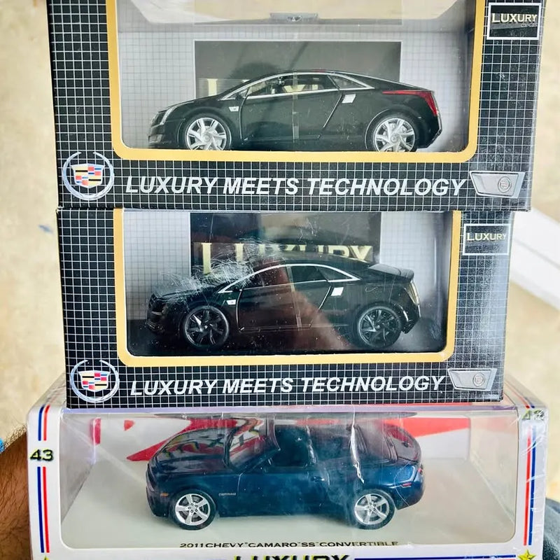 Collectible black diecast sports car model in retail box