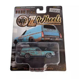 Toy diecast panel van car in blister packaging, blue and brown barn find style