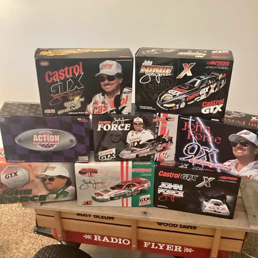 Diecast model car boxes with Castrol GTX racing decals and graphic artwork