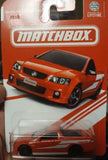 Orange Matchbox Holden ute diecast model in blister pack, front view