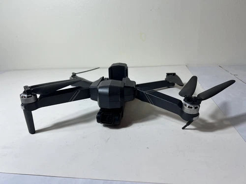 Gray camera drone with 2-axis gimbal, folded propellers and four rotors