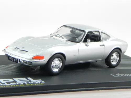 Silver diecast Opel GT coupe model car, front three-quarter view on display base
