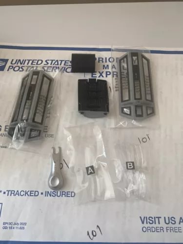 Tie Fighter advanced drone parts in clear plastic bags with black connectors