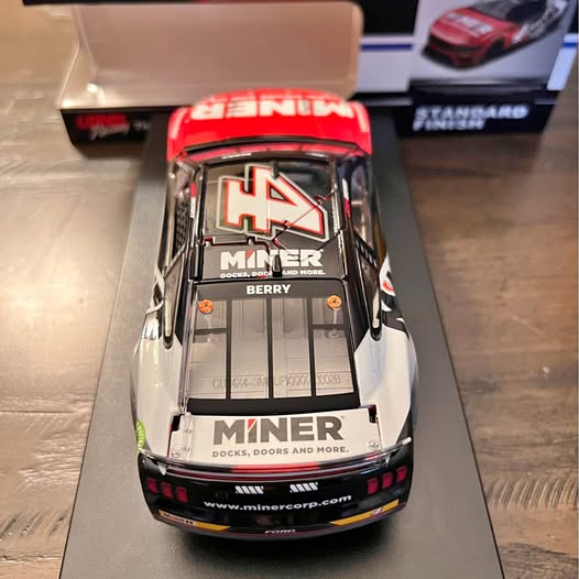 1:24 scale diecast race car in white and red with Miner logo