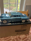 Tucker 1948 mint-blue diecast car model, black stripe, whitewall tires