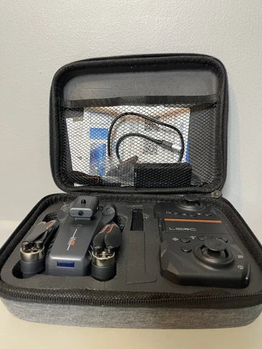 Folding drone carrying case with remote controller and compact quadcopter
