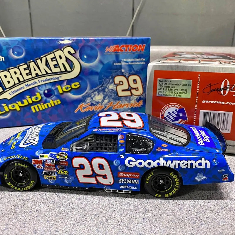 Blue race diecast car with #29 Goodwrench branding and driver helmet design