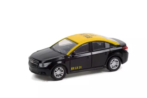Black taxi die-cast model car with yellow roof stripe and silver wheels