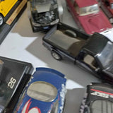 Diecast metal toy cars set with blue and black vehicles, open windows