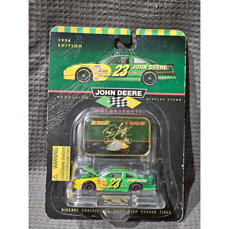 NASCAR John Deere #23 diecast car in retail blister pack, green and yellow.
